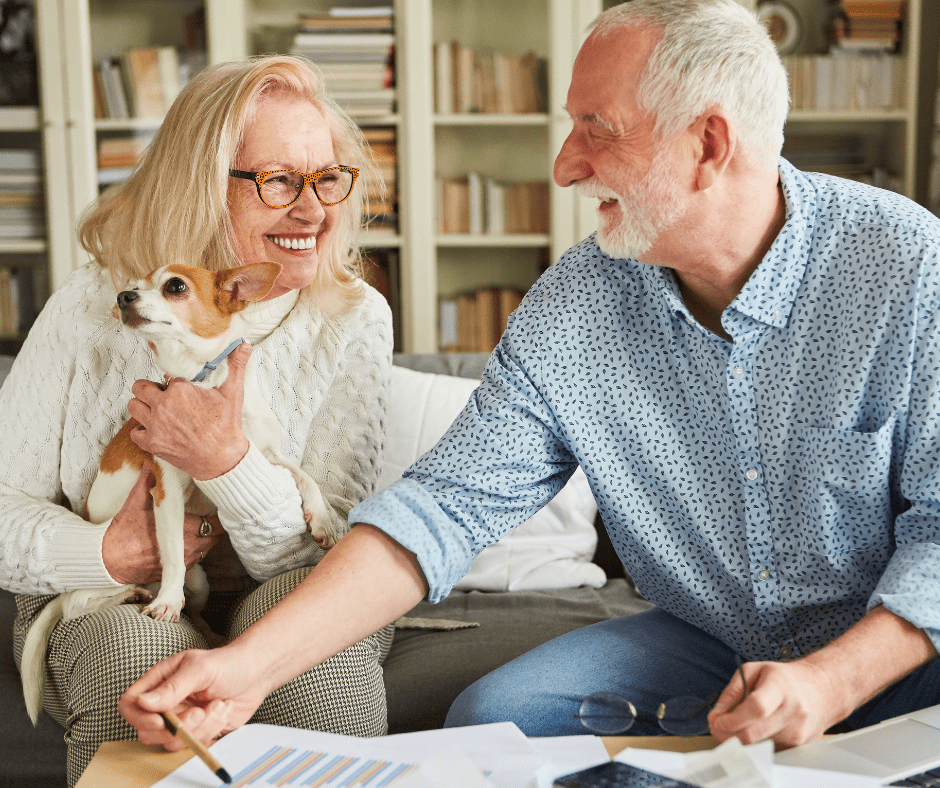 April 25 Events Page Image - Vista Pointe at Sierra Vista Elderly man and woman smiling and holding small dog